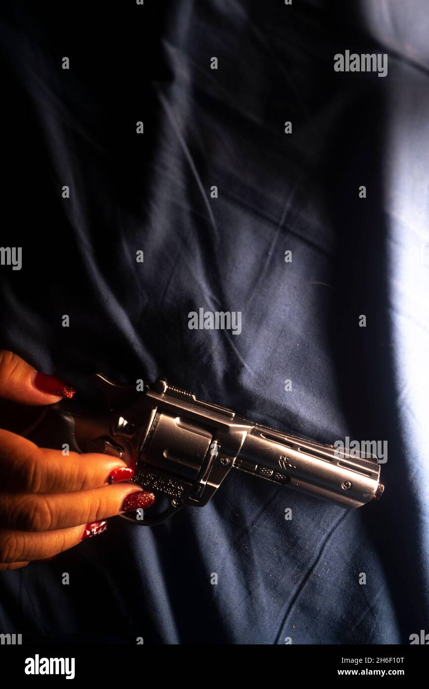 confused african american female secret agent with rifle, isolated on white  Stock Photo - Alamy