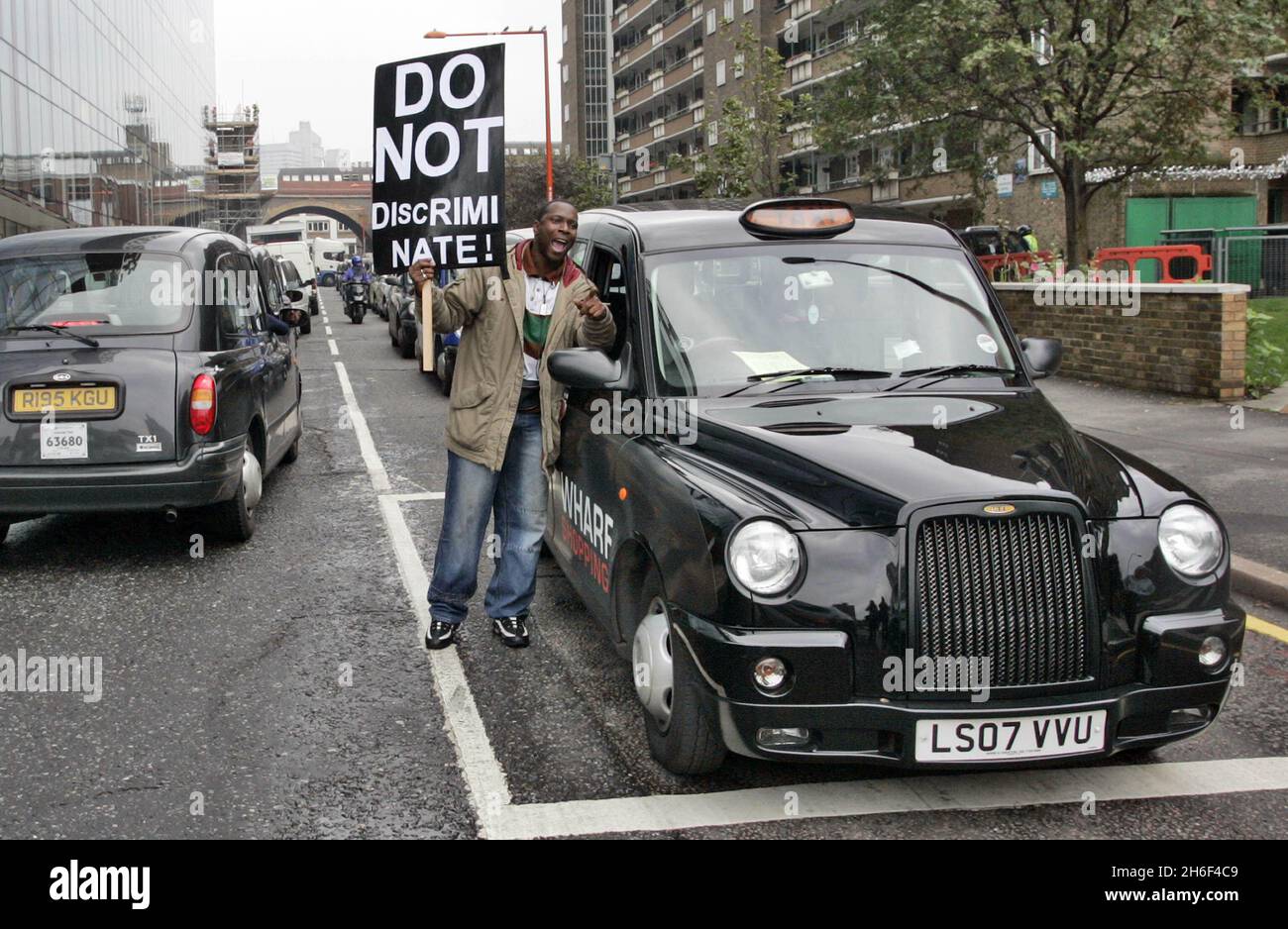 London cab drivers took to the streets in central London today to protest for equal rights as immigrants and women are to be given easier tests and grants to pass the Knowledge. Stock Photo