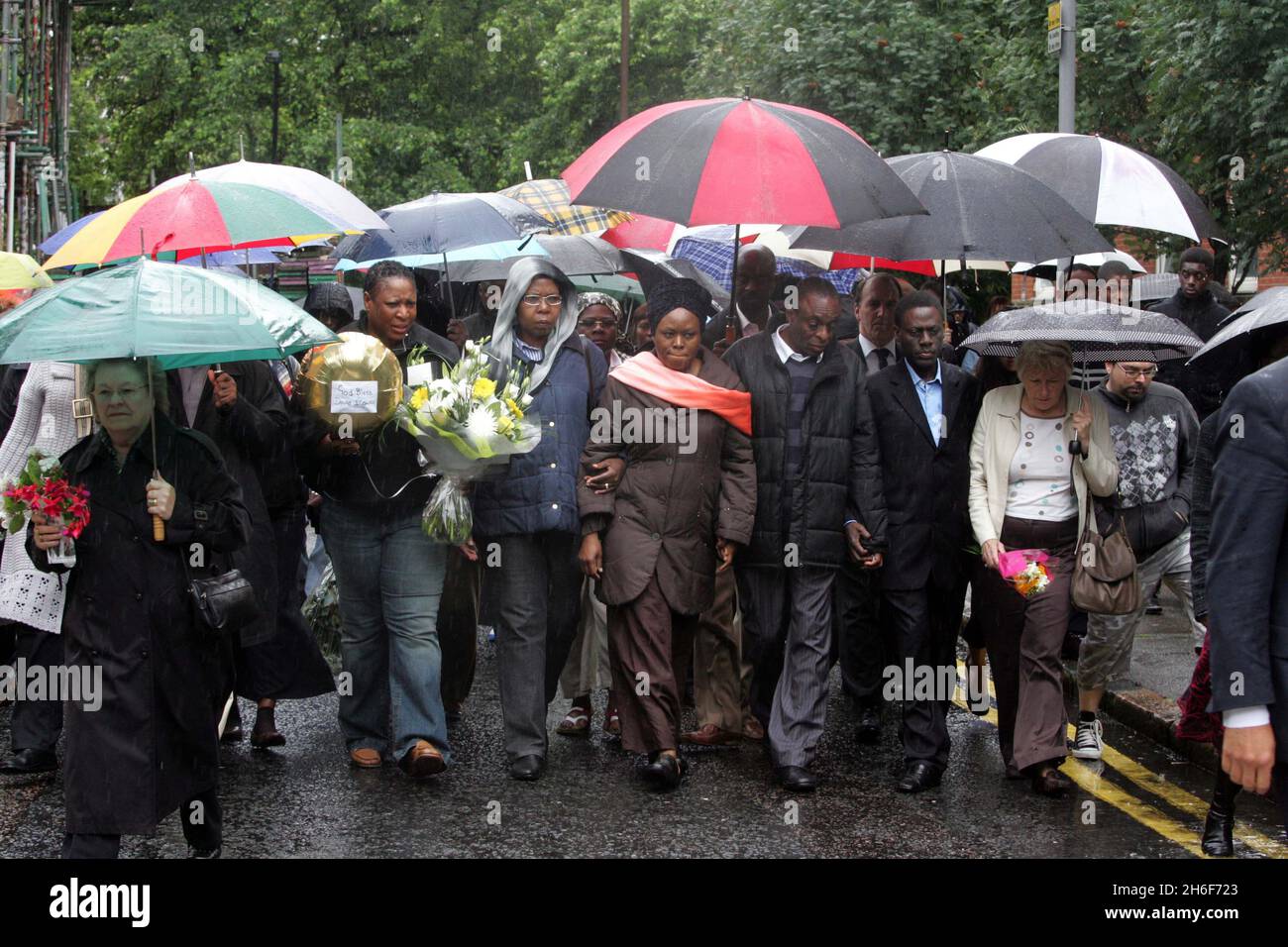 The mother and family of 14 year old murder victim David Idowu laid flowers at the scene where he died in Walworth, South London. Stock Photo