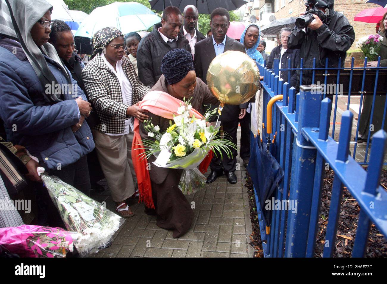 The mother and family of 14 year old murder victim David Idowu laid flowers at the scene where he died in Walworth, South London. Stock Photo