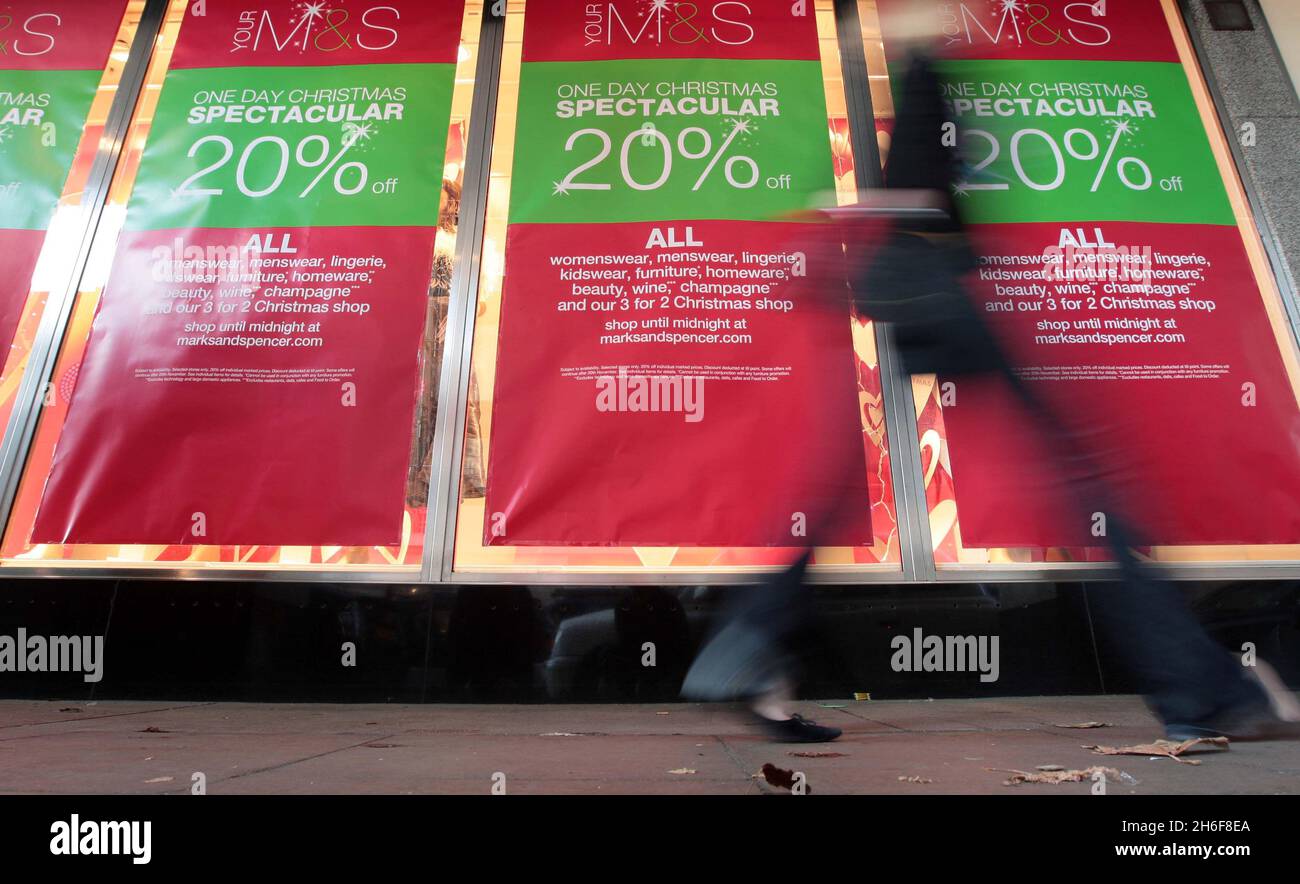 There was no stampede of customers as shops on Oxford Street in London, including Marks & Spencers and Debenhams, opened early for the start of their percentage off sales. Stock Photo