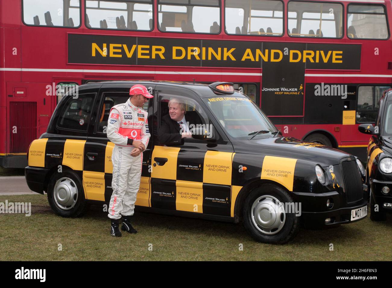 Mayor of London Boris Johnson backing Lewis Hamilton, the 2008 Formula 1  World Champion, as he drove a London taxi, to reinforce the Johnnie Walker  anti-drink drive campaign, reminding people to never