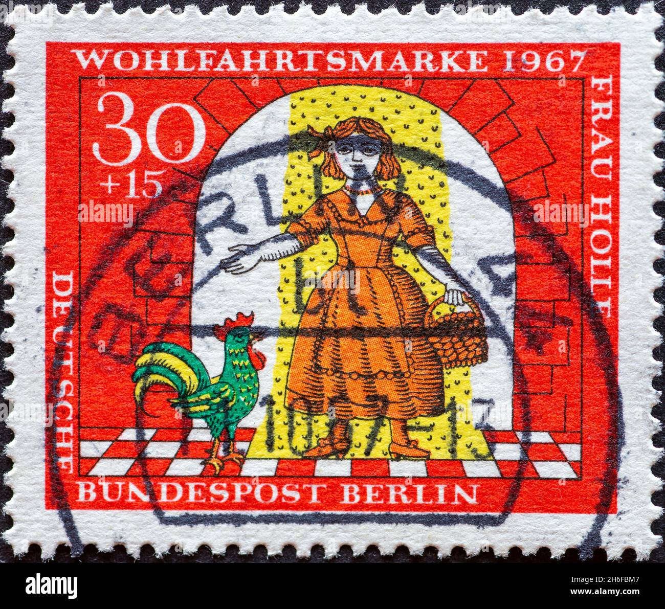 GERMANY, Berlin - CIRCA 1967: a postage stamp from Germany, Berlin showing a picture from the fairy tale of the Brothers Grimm: Frau Holle. Gold Marie Stock Photo