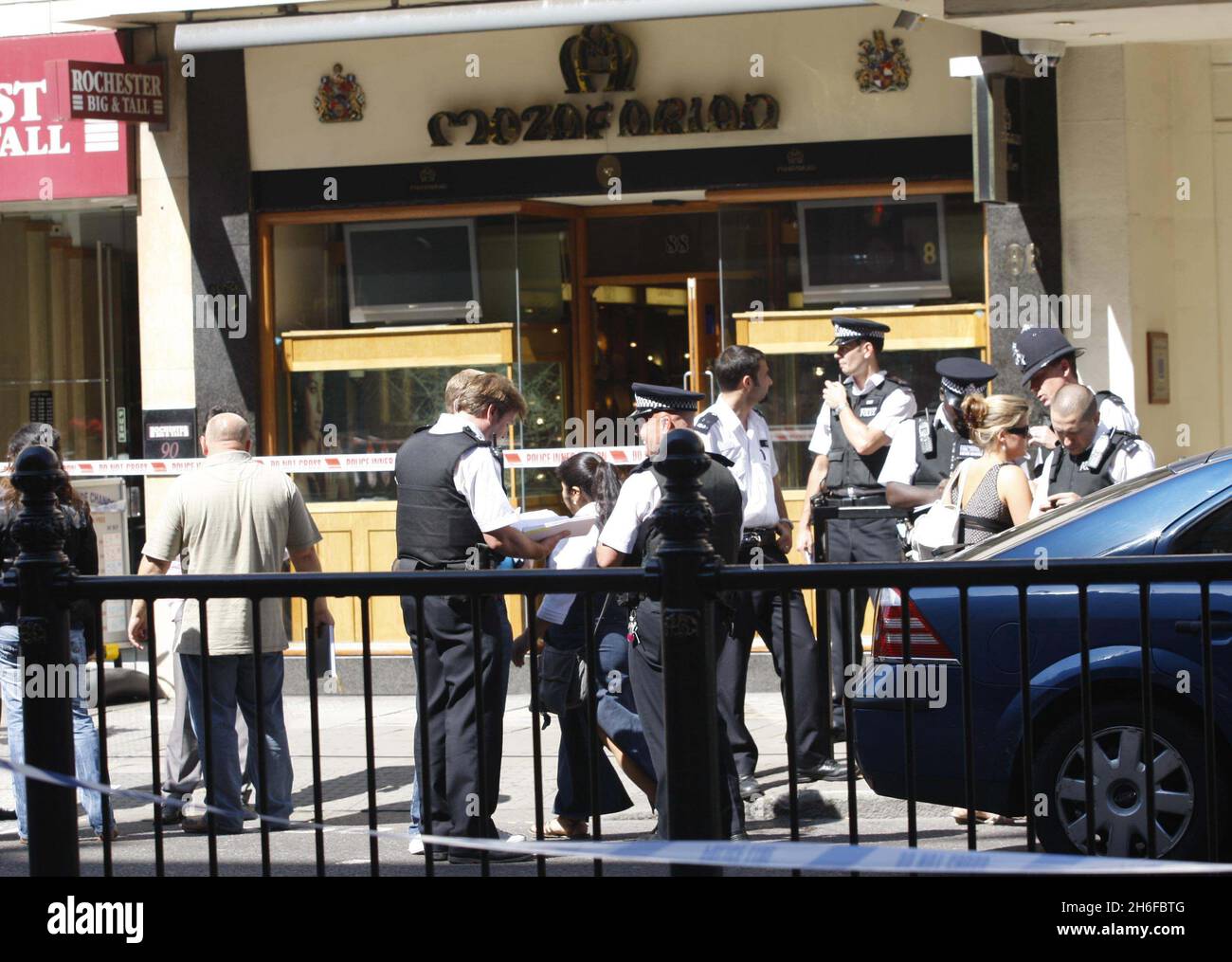 Police at the scene of a smash and grab robbery at a jewellers opposite Harrods this afternoon, London. Stock Photo