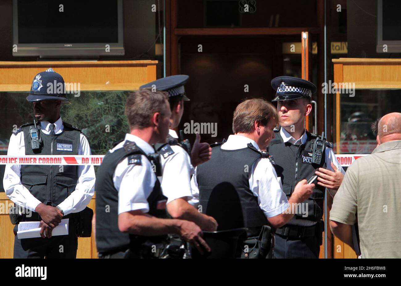 Police at the scene of a smash and grab robbery at a jewellers opposite Harrods this afternoon, London. Stock Photo