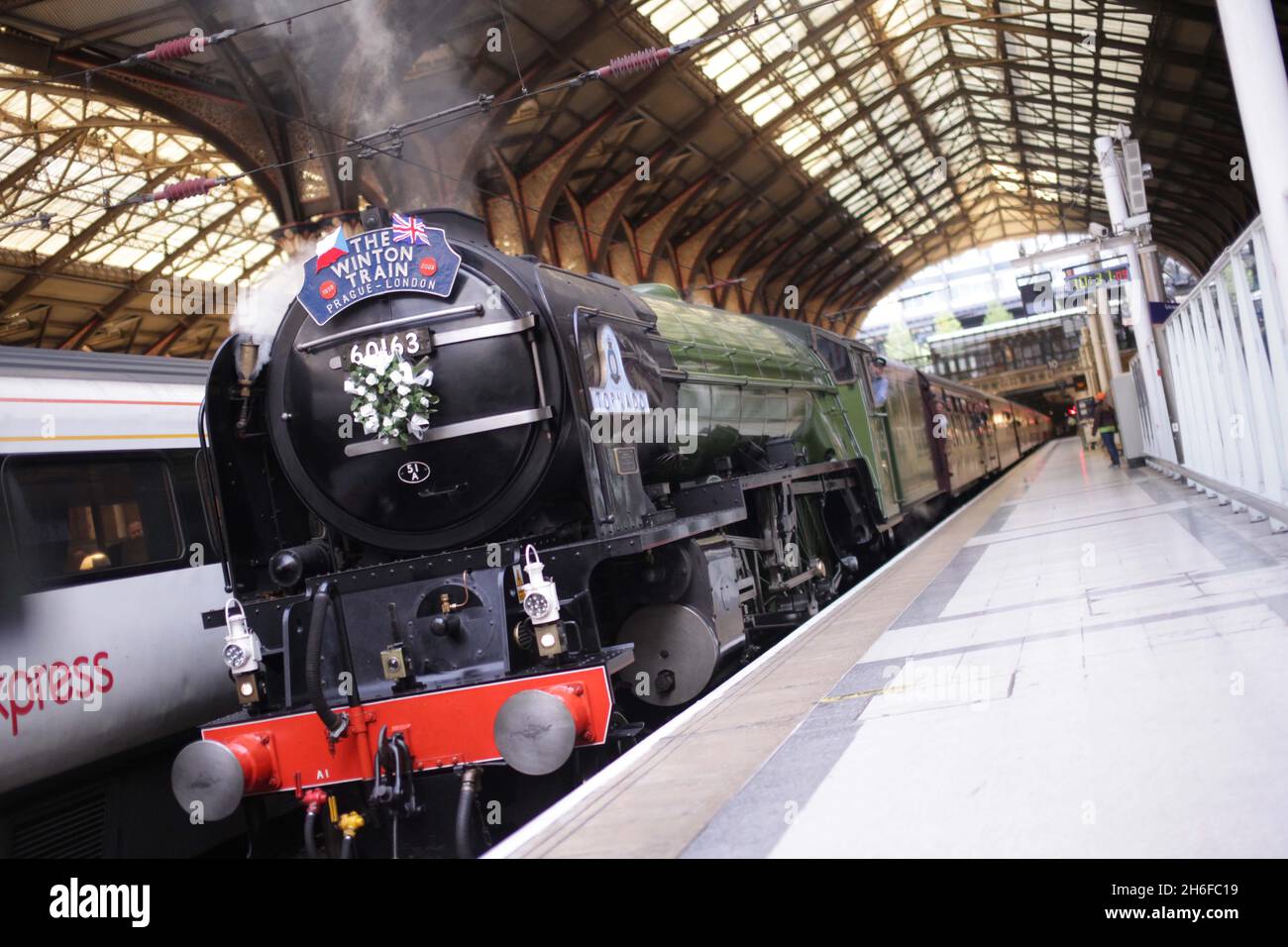 A steam train recreating the journey of hundreds of child evacuees, rescued from the Nazi's by a man dubbed Britain's Oscar Schindler, arrived at Liverpool Street station in London today. Seventy years after Sir Nicholas Winton organised for 669 Jewish children to travel from Prague to London to escape concentration camps, some of the survivors retraced their journey. Sir Nicholas, who celebrated his 100th birthday in May, was at the Station to see the steam train arrive. Stock Photo