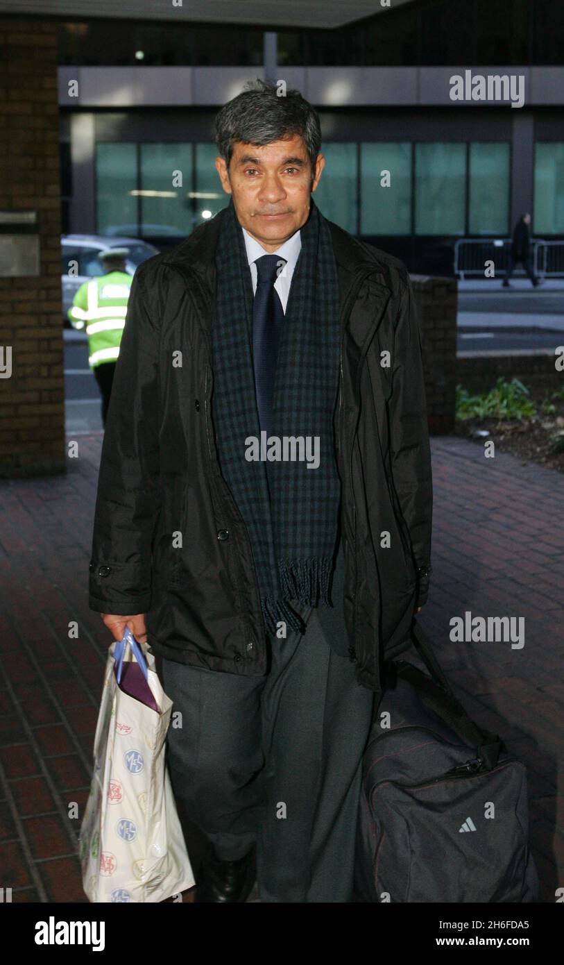 Dentist & son sentenced for insider dealing - Neel Akash Uberoi, 62, & his son Matthew Uberoi, 24, both of Kenley in Surrey, arrive at Southwark Crown Court this afternoon to be sentenced on 12 counts of insider dealing relating to the ownership of shares after Matthew, on a placement with broker Hoare Govett, passed emails to his father using Chinese food as code for takeover deal information which Neel then used to buy and sell shares Picture shows: Neel Akash Uberoi Stock Photo