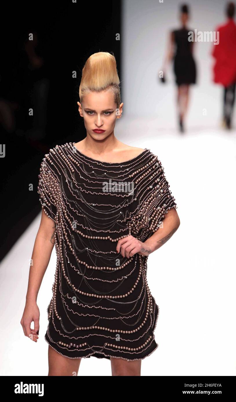 Model Alice Dellal dispays a creation by Issa as part of London Fashion Week at BFC at Somerset House, London Stock Photo