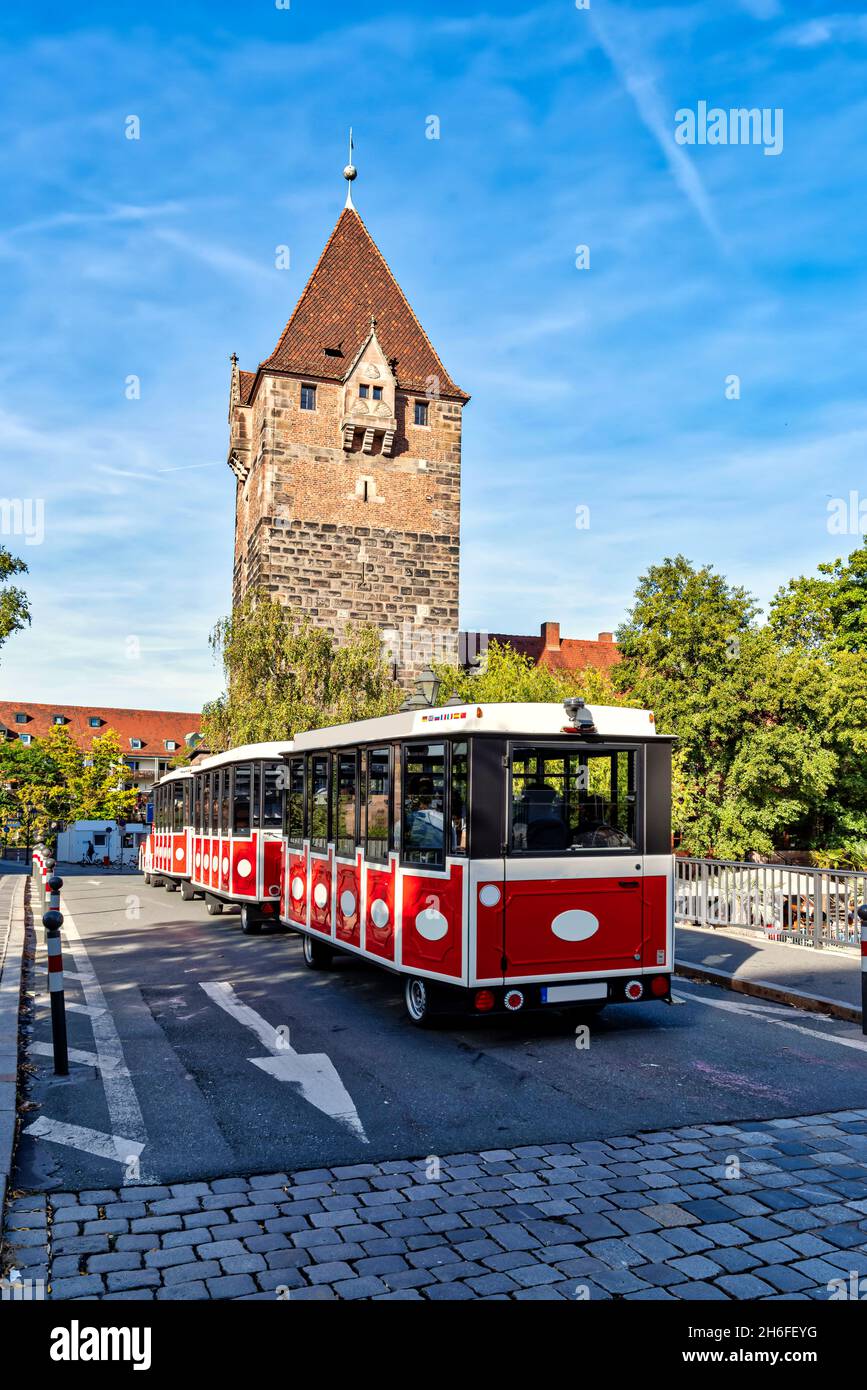Schuldturm tower with city train on the bridge in Nuremberg, Germany Stock Photo