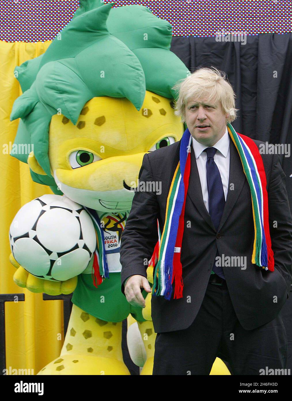 The Mayor of London Boris Johnson welcomes the start of the Fifa World Cup alongside Zakumi the Official Mascot of the 2010 World Cup with local children in Trafalgar Square, London Stock Photo