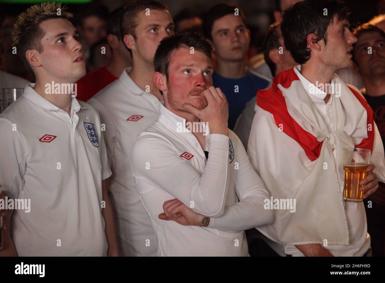 England football fans watch the gamel at The Sports Cafe in London's Haymarket this afternoon Stock Photo