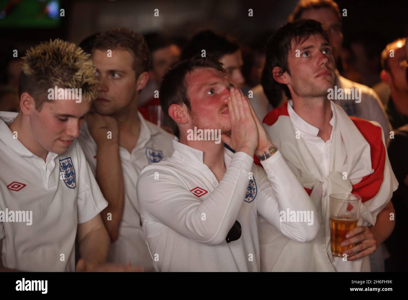 England football fans watch the game at The Sports Cafe in London's Haymarket this afternoon Stock Photo