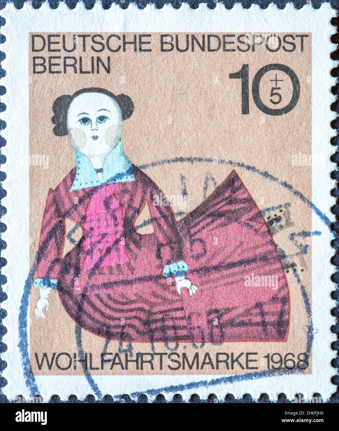 GERMANY, Berlin - CIRCA 1968: a postage stamp from Germany, Berlin showing a charaty postal stamp old dolls. Doll at 1878 beige Stock Photo