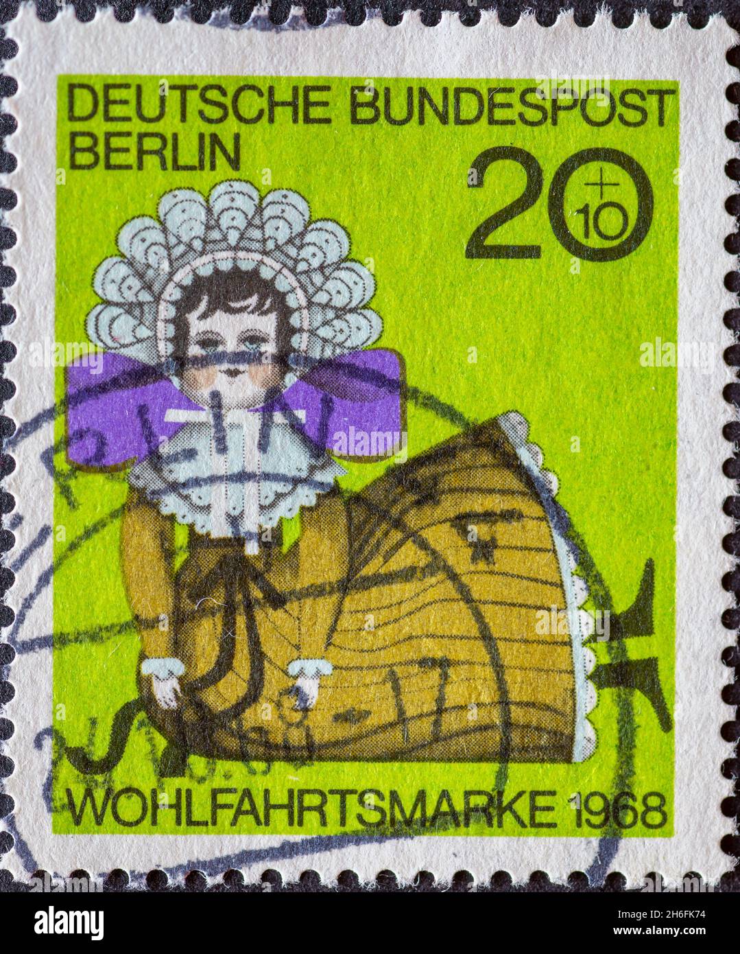 GERMANY, Berlin - CIRCA 1968: a postage stamp from Germany, Berlin showing a charaty postal stamp old dolls. Doll at 1850 green Stock Photo