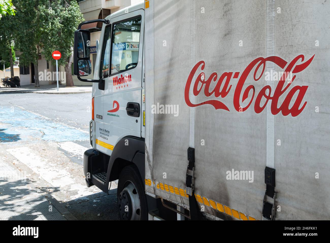 PLASENCIA, SPAIN - May 11, 2021: Plasencia, Spain - May 11, 2021: White Coca Cola soft drink truck Coke brand logistic deliver soft drinks and product Stock Photo