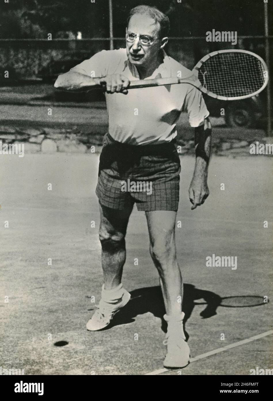 American 87-year-old senator Theodore Francis Green playing tennis, USA 1954 Stock Photo