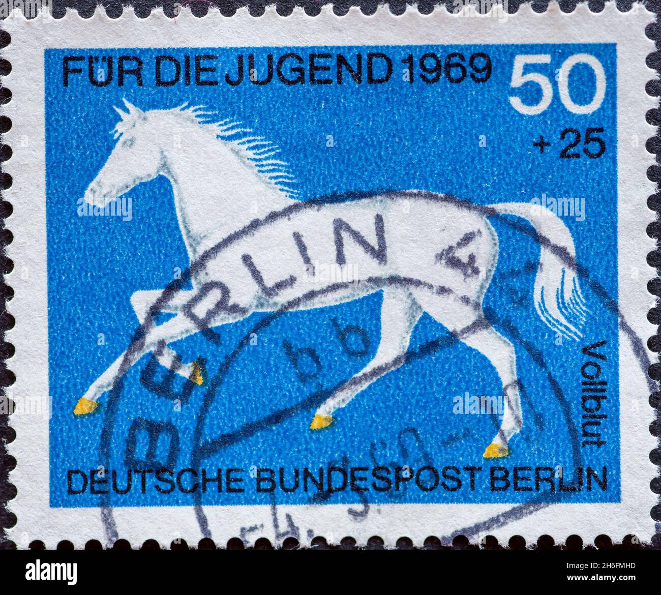 GERMANY, Berlin - CIRCA 1969: a postage stamp from Germany, Berlin showing Noble horse breeds: thoroughbred Charity postal stamp for the youth Stock Photo