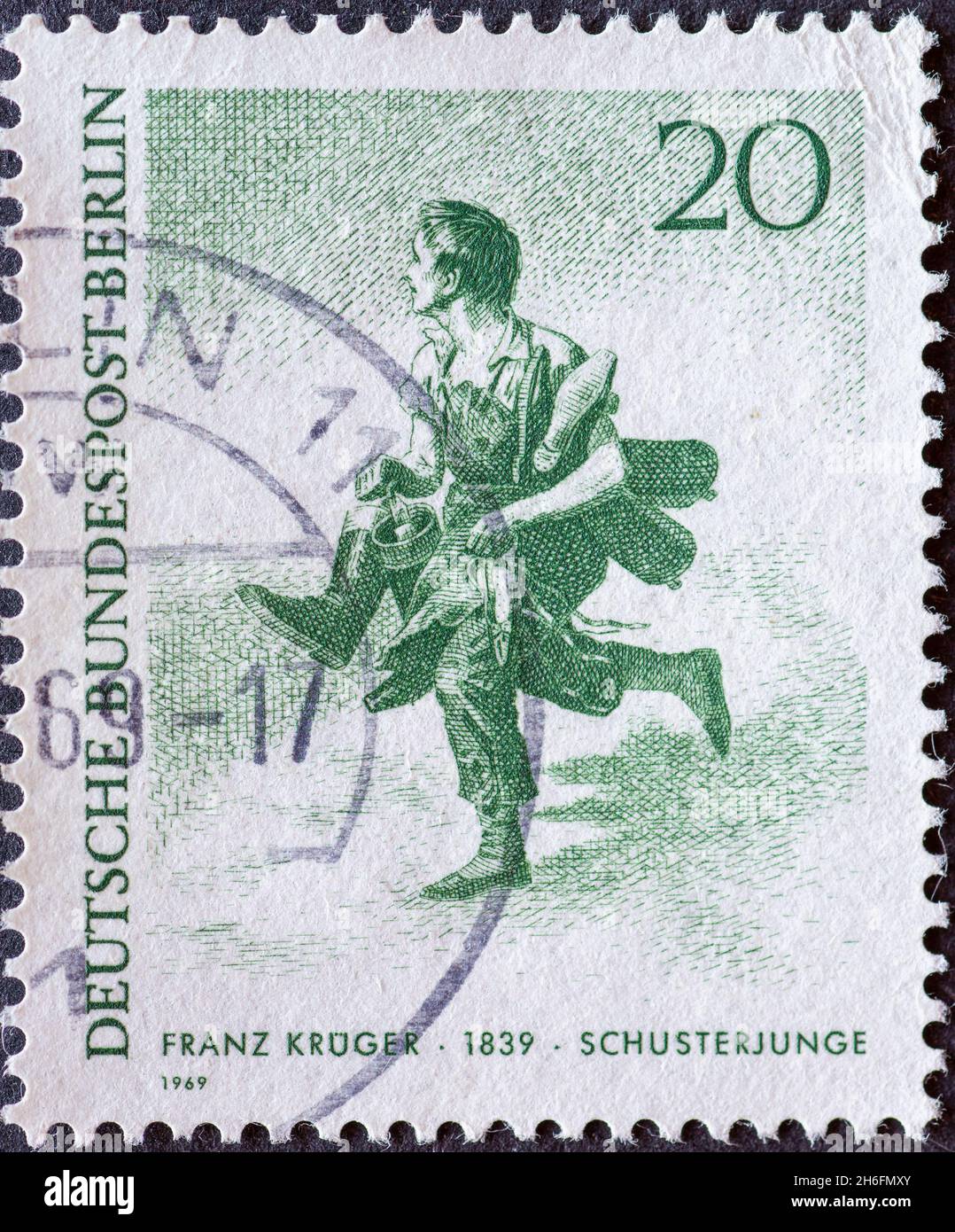 GERMANY, Berlin - CIRCA 1969: a postage stamp from Germany, Berlin showing 19th century Berliners.  Franz Krüger shoemaker boy Stock Photo