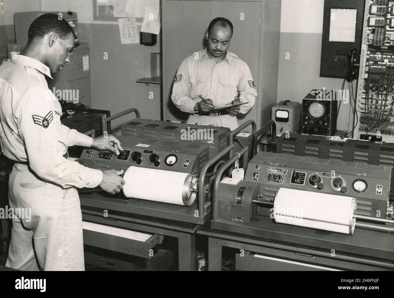 Employees at the US National Weather Analysis Center making copies of