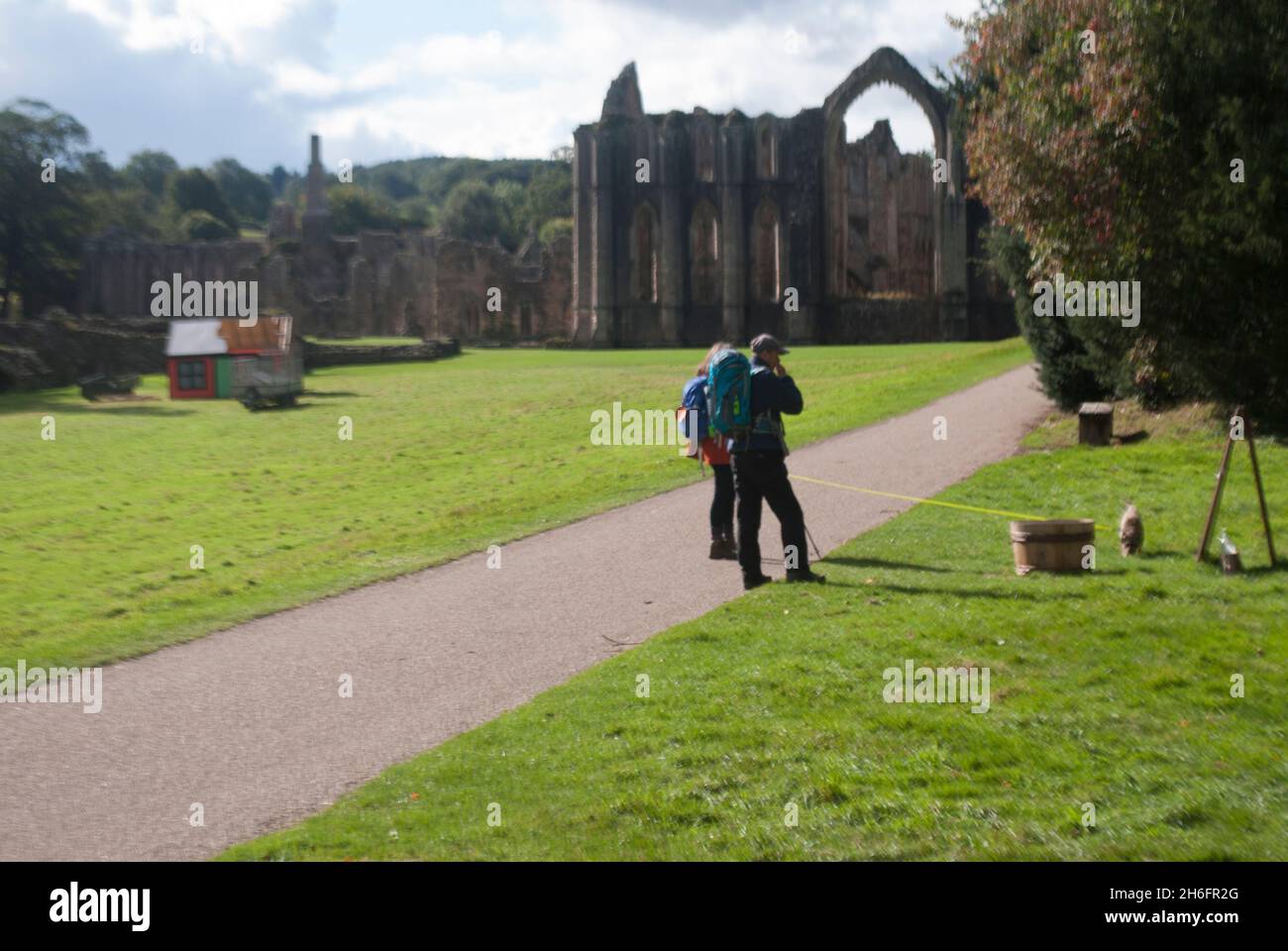 Visitors walking on path near twoer and Chapel of the Altars, Fountains