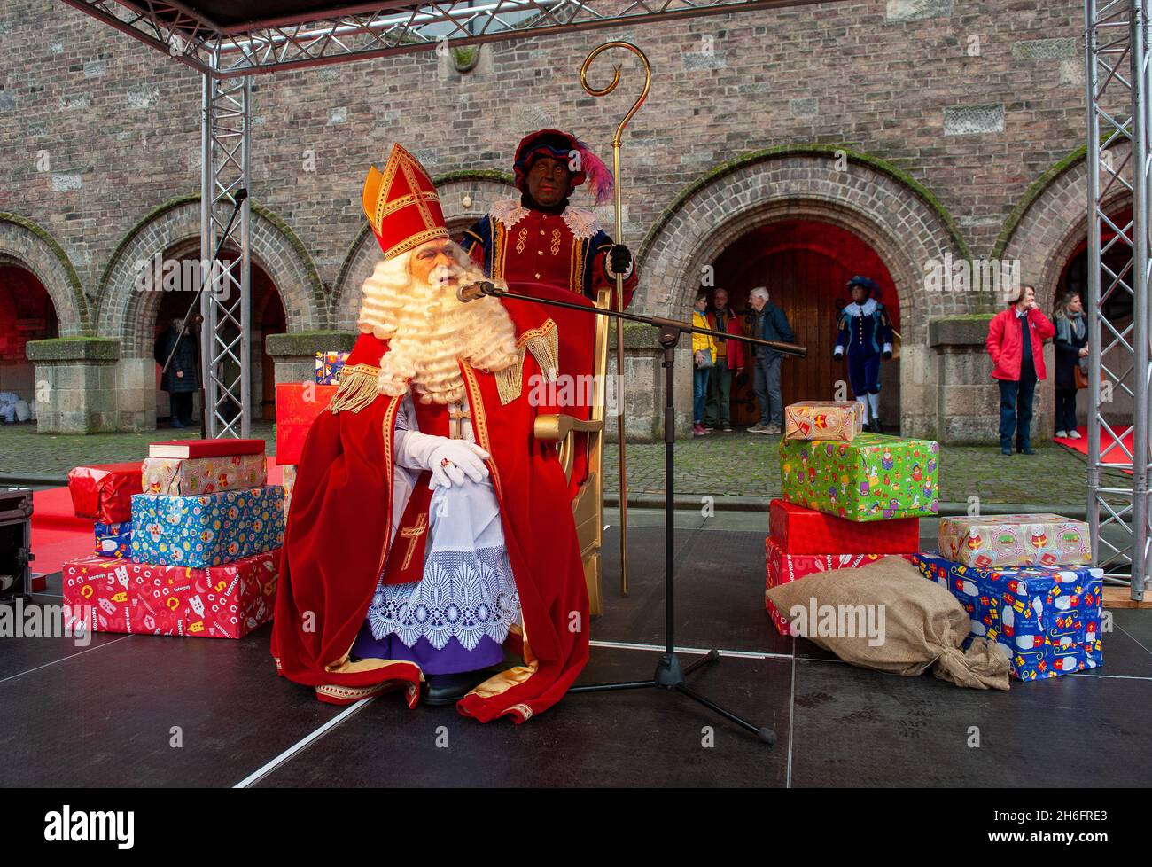 ENSCHEDE, THE NETHERLANDS - NOV 13, 2021: The dutch Santa Claus called 'Sinterklaas' is arriving in town. This year he is sitting on a chair in front Stock Photo