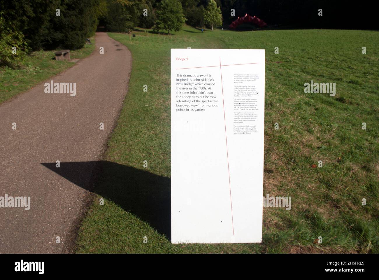 Sign for 'Bridged' art installation Studley Royal Water Gardens, Studley Royal Park, Fountains Abbey, Aldfield, near Ripon, North Yorkshire, England Stock Photo