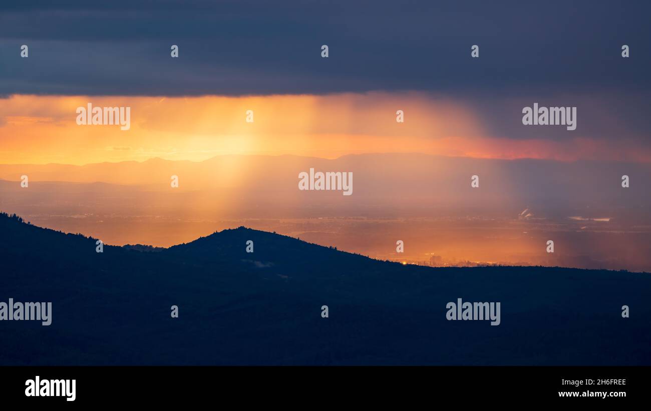 Breathtaking play of colours during the golden hour over the Rhine plain in the northern Black Forest and in Alsace Stock Photo