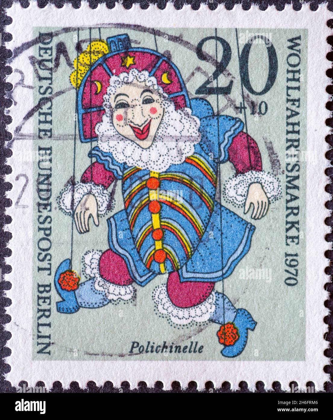 GERMANY, Berlin - CIRCA 1970: a postage stamp from Germany, Berlin showing a charity postal stamp from 1970 with historical puppet. Here: Polichinelle Stock Photo