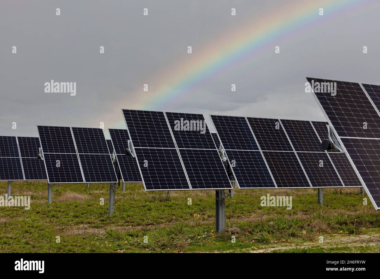 Rainbow over Solar farm, Mid-Michigan, USA, by James D Coppinger/Dembinsky Photo Assoc Stock Photo