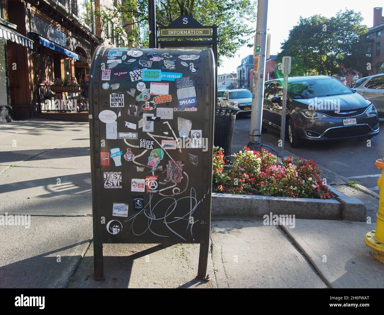 Stickers on a post box along Broadway in Saratoga Springs, New York, USA, 2021 © Katharine Andriotis Stock Photo