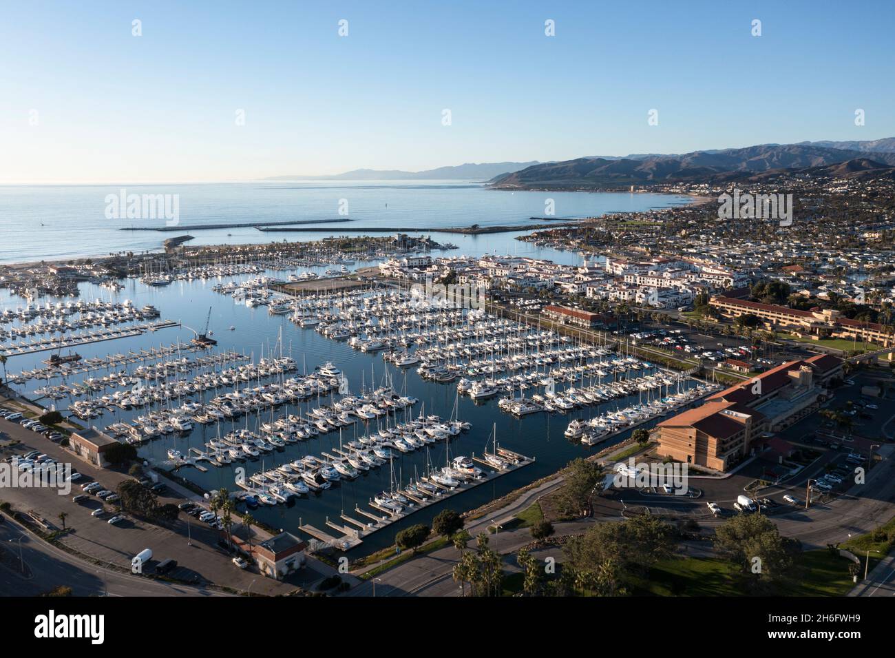 Ventura Harbor along the California coast full of sailboats aerial Stock Photo