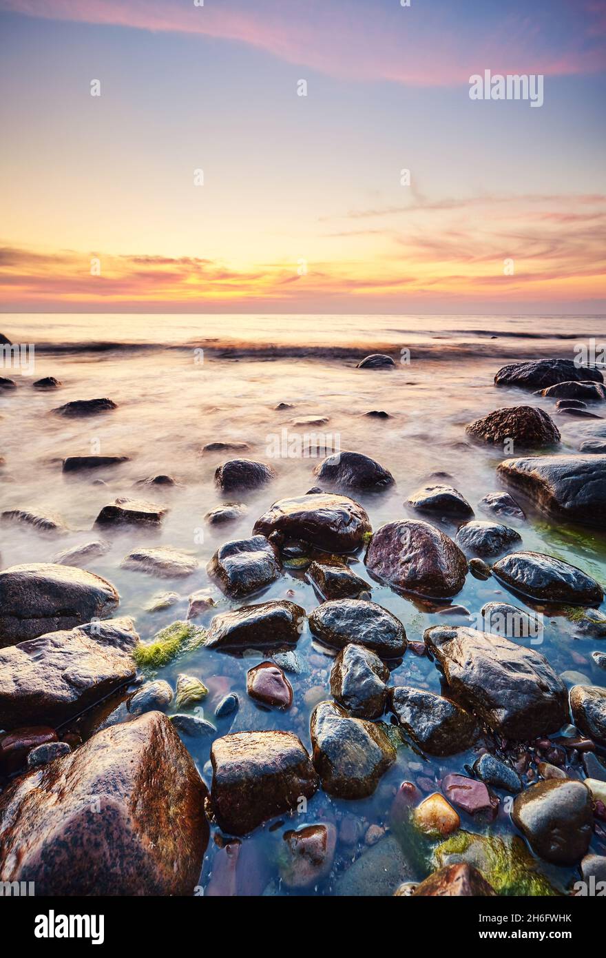 Rocky beach at a beautiful sunset. Stock Photo