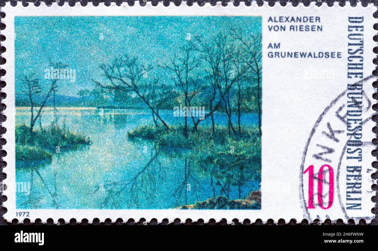 GERMANY, Berlin - CIRCA 1972: a postage stamp from Germany, Berlin showing a picture of Grunewald lake by the painter Alexander von Riesen Stock Photo