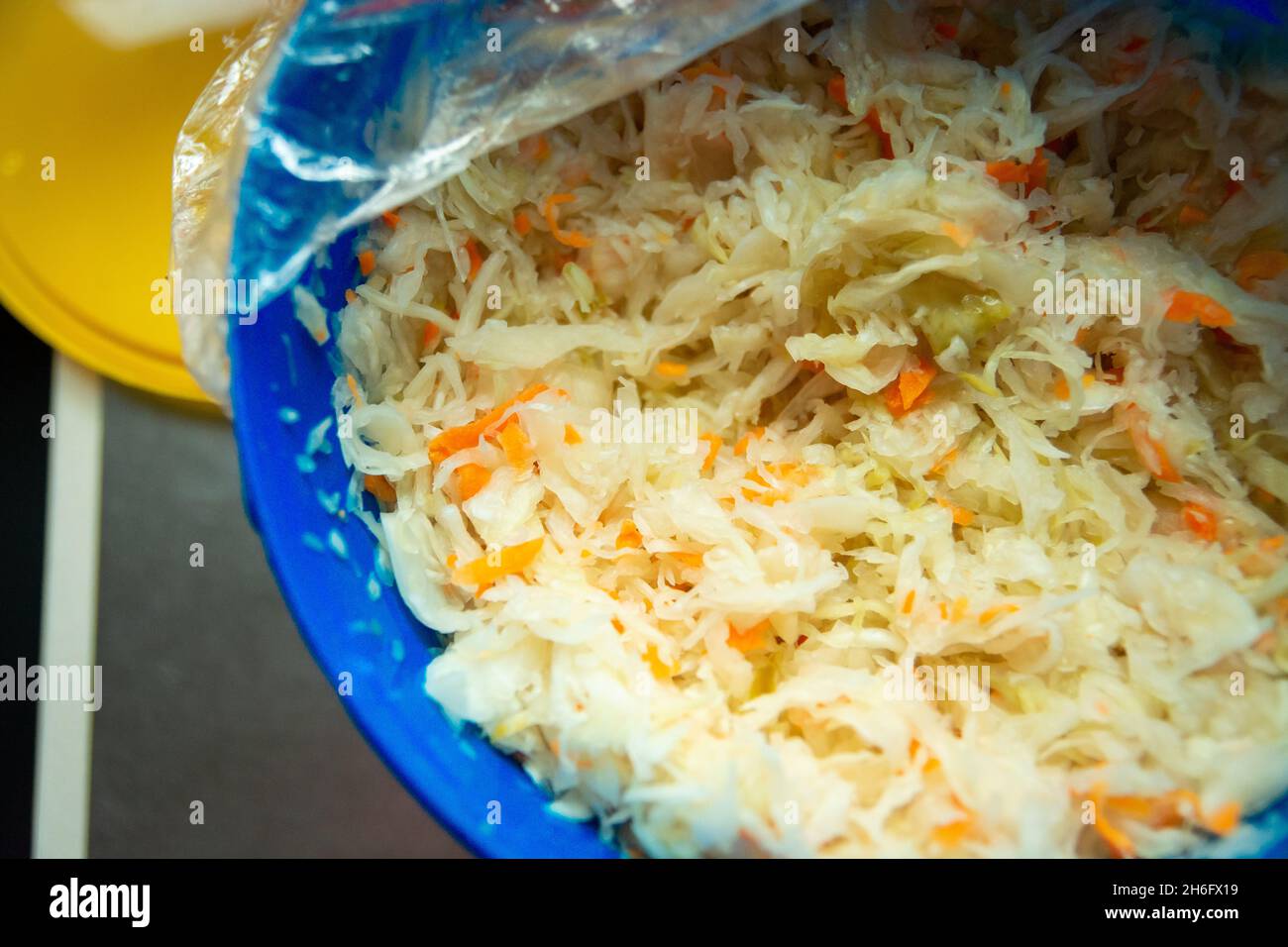 Sauerkraut in a blue plastic container, top view Stock Photo