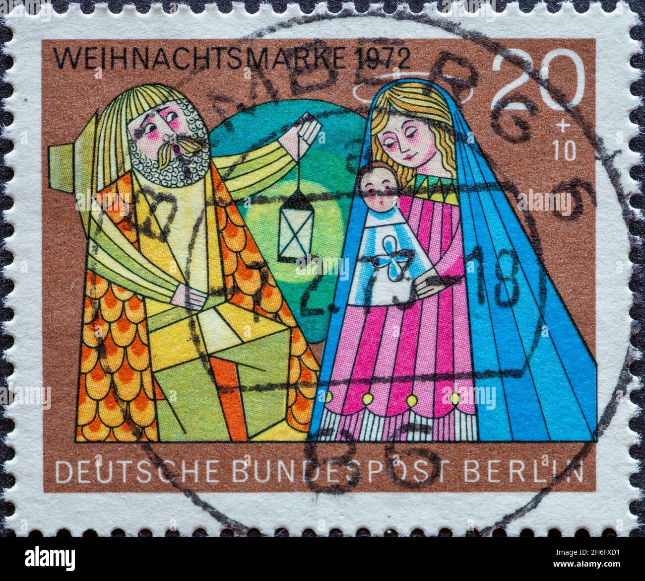 GERMANY, Berlin - CIRCA 1972: a postage stamp from Germany, Berlin showing a Christmas charity postal stamp from 1972 painting of the 'Holy Family' Stock Photo