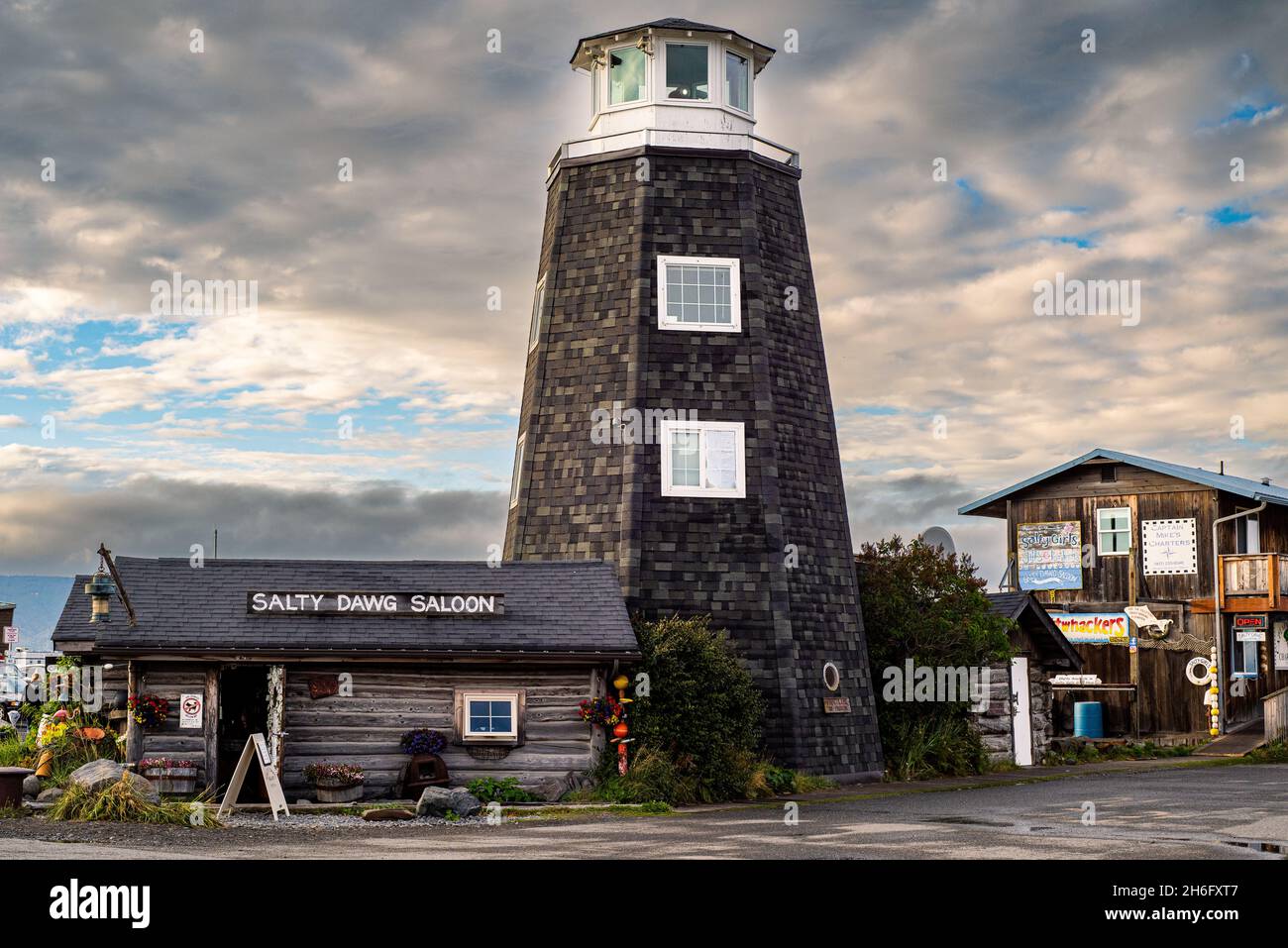 Homer Spit, Alaska, USA - August 07, 2018: The famous Homer Spit lighthouse and pub Salty Dawg Salon Stock Photo