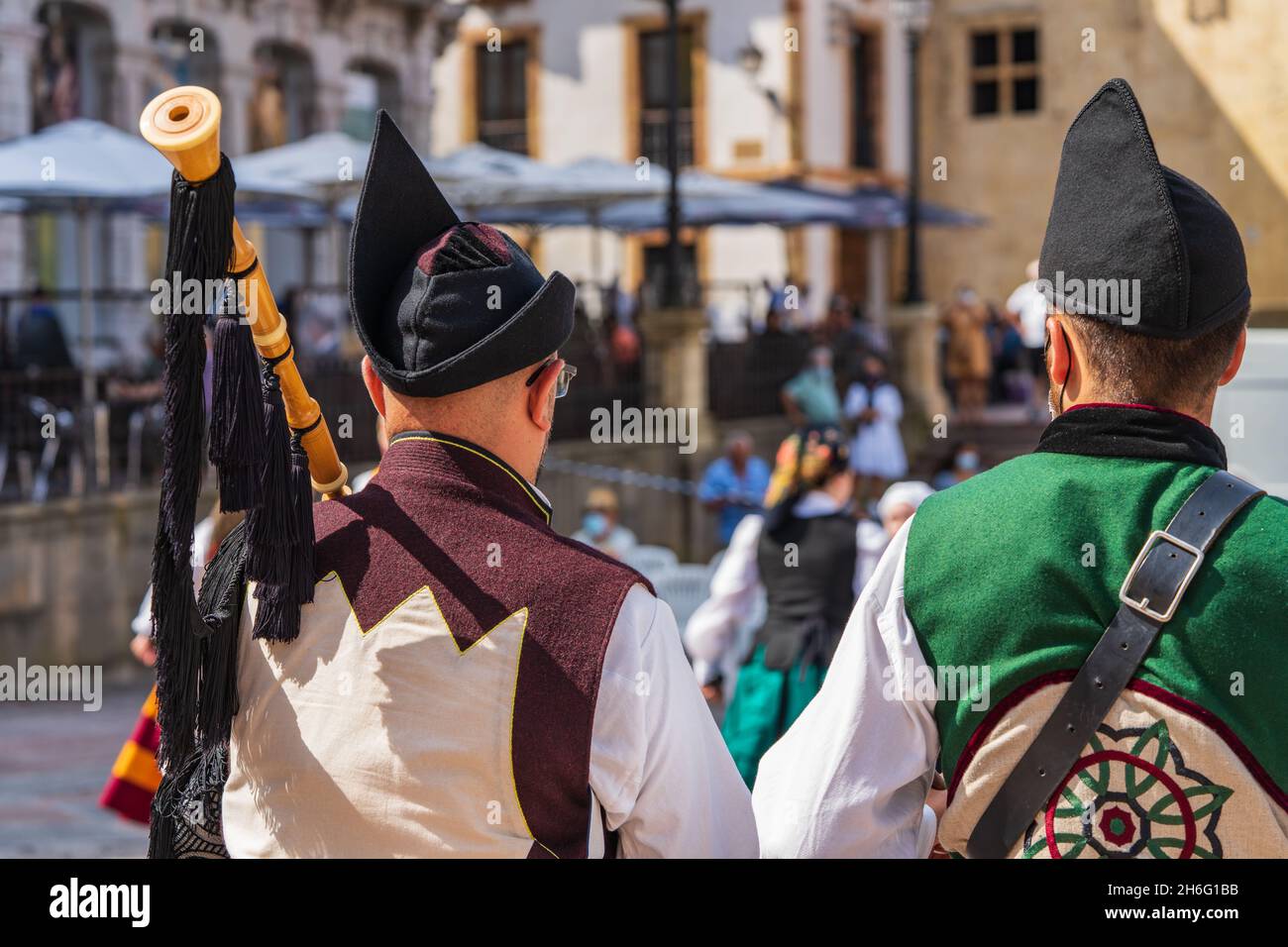 Two men dressed in Asturian costume playing the drum and bagpipes in a square in Oviedo, Uvieu, in Asturias.  Stock Photo