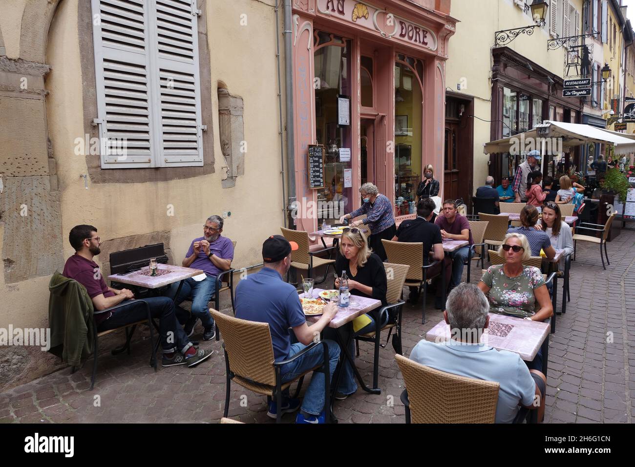 Customers dining outside French restaurant in Colmar, France Stock ...