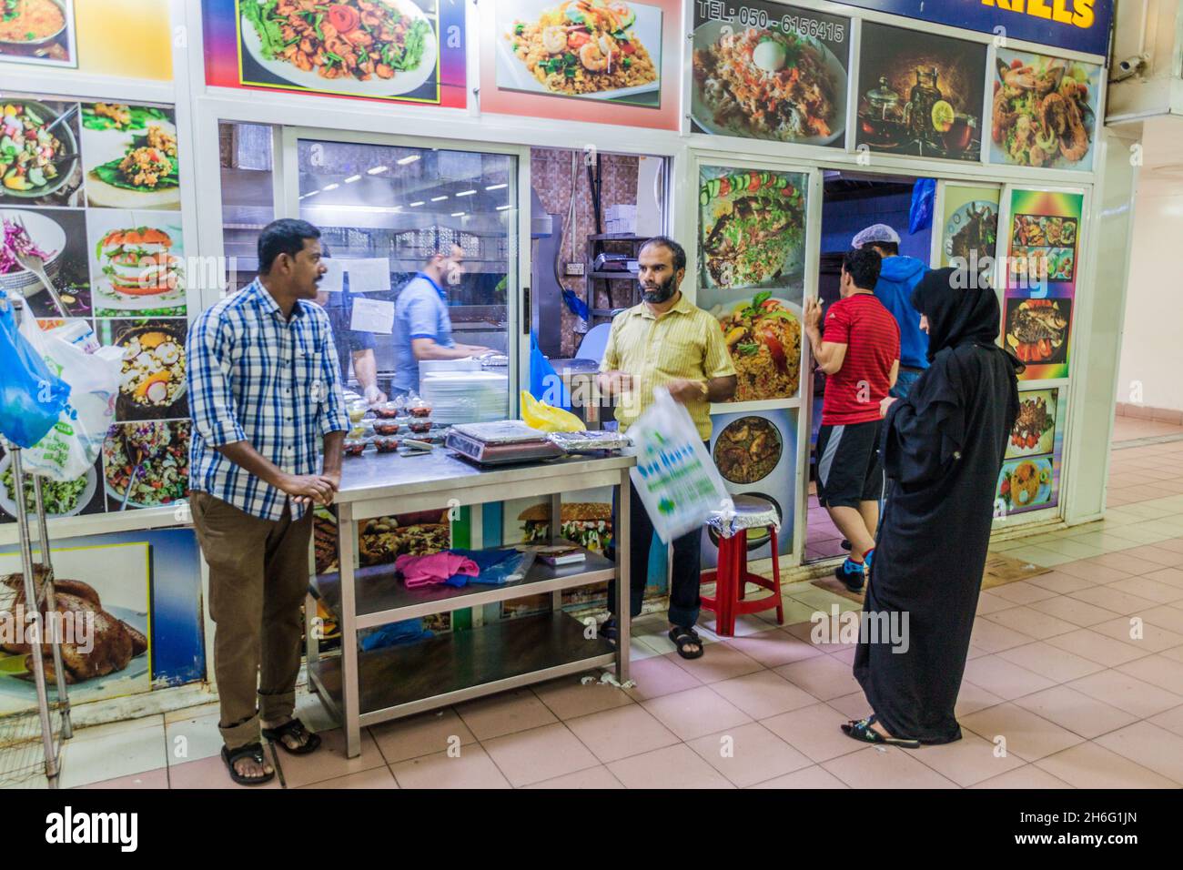 ABU DHABI, UAE - MARCH 9, 2017: Food stall at Al Mina fish market in Abu Dhabi. Stock Photo