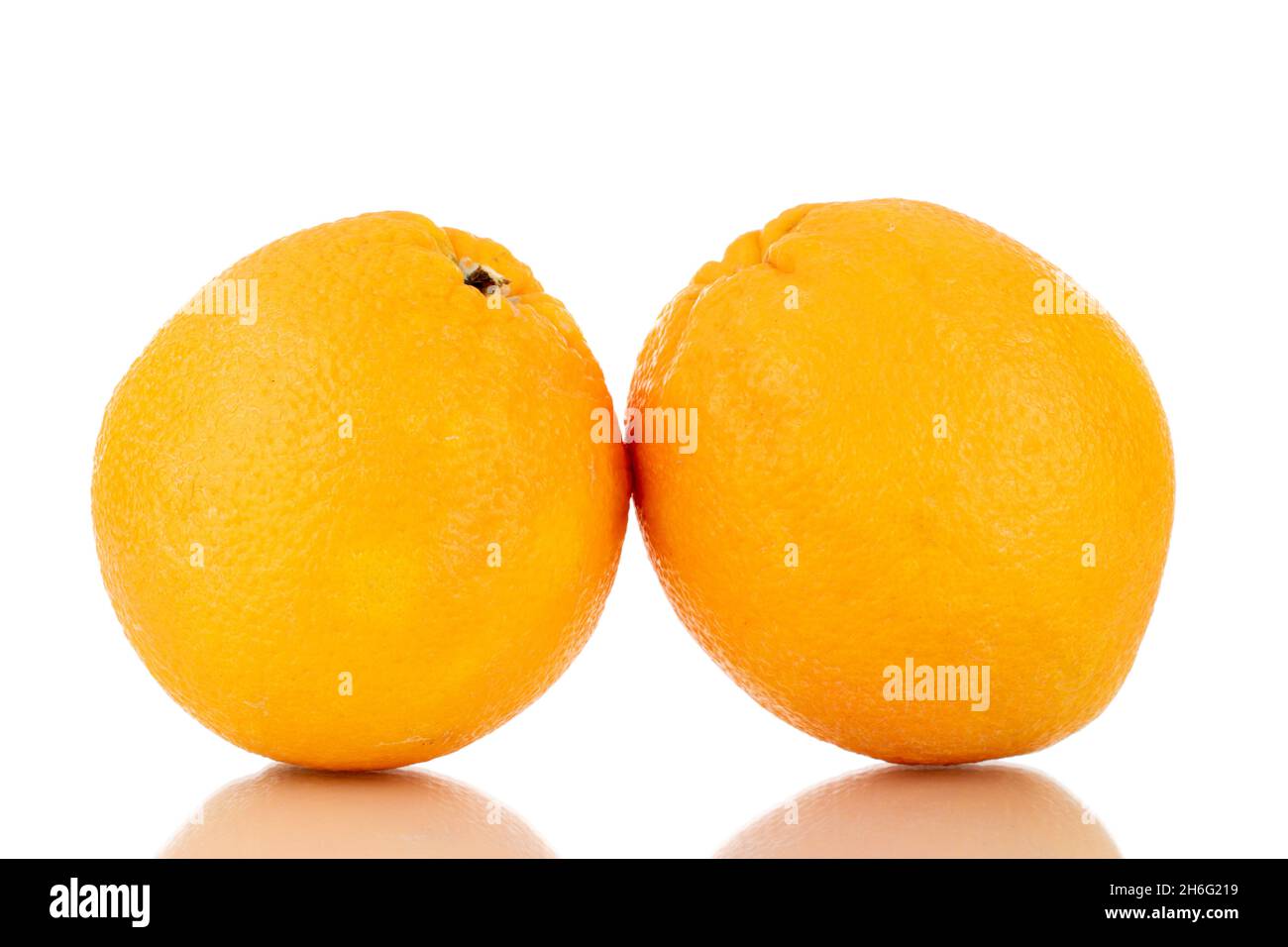 Two organic bright yellow oranges , closeup, isolated on white Stock Photo Alamy