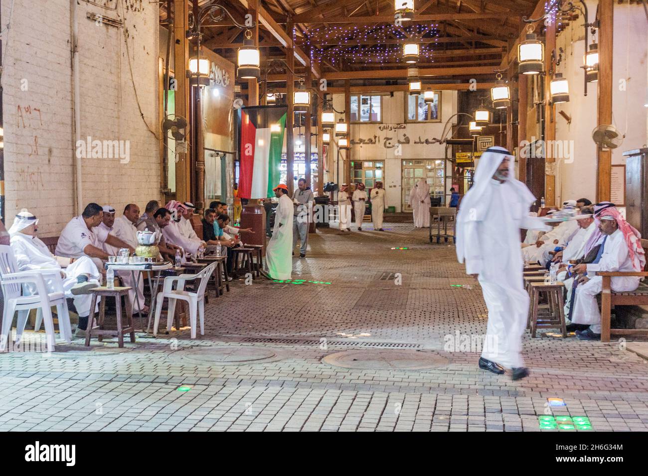 KUWAIT CITY, KUWAIT - MARCH 17, 2017: Local men at the traditional cafe at the central Souq in Kuwait City Stock Photo