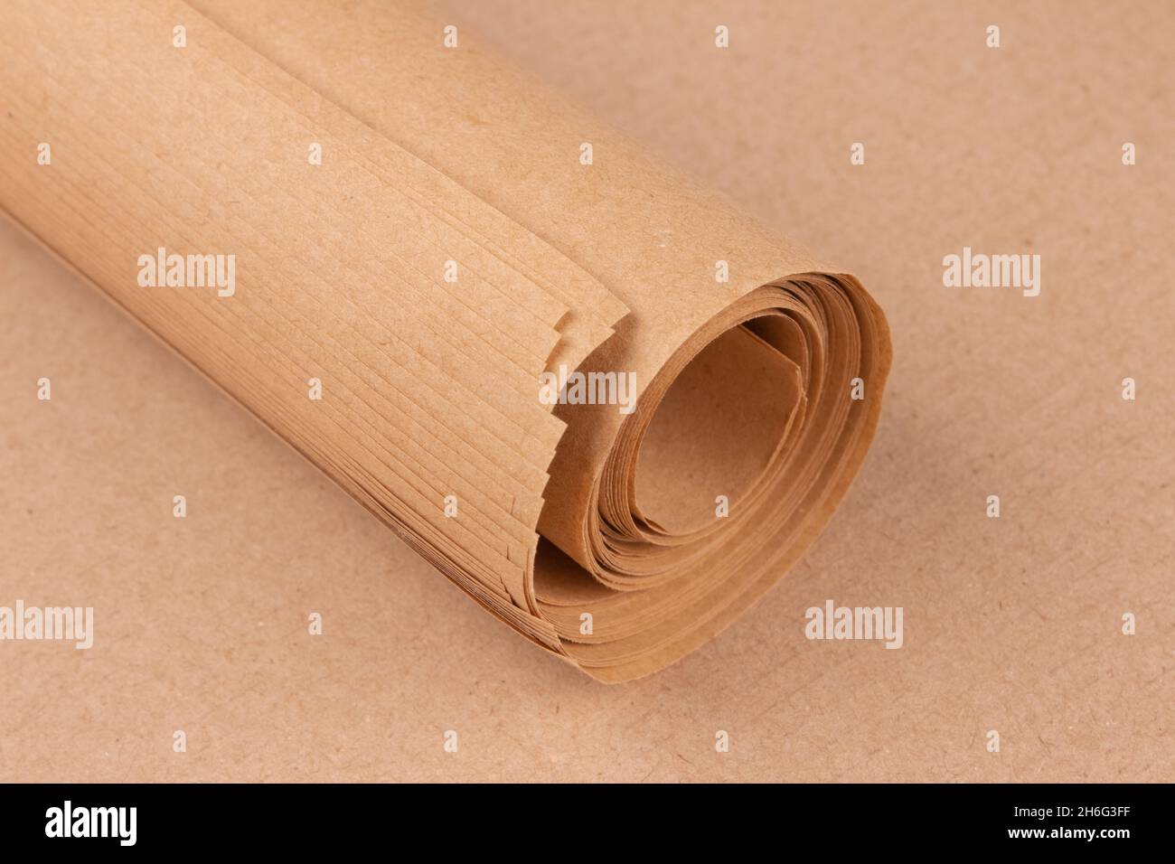 Brown kraft wrapping paper roll. Ecofriendly kraft paper sheets for