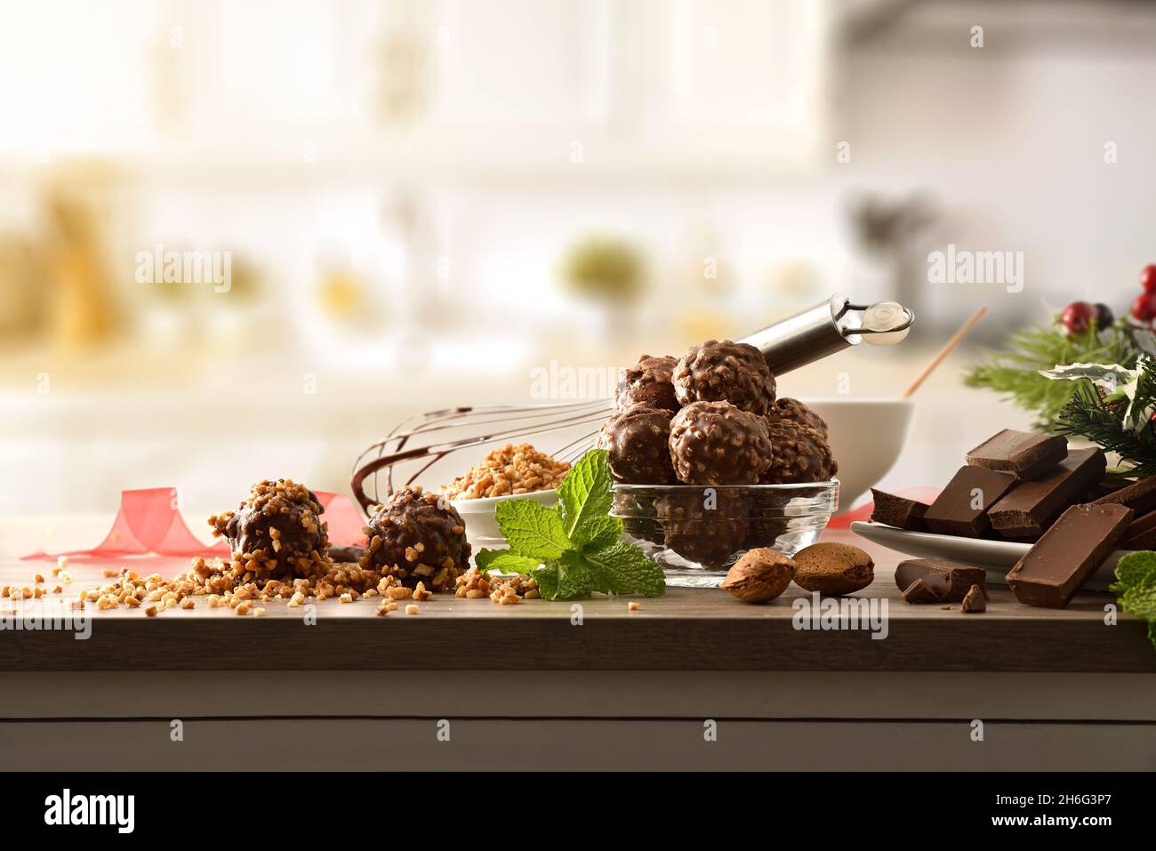 Preparing chocolate balls with almond chips on a kitchen bench. Front view. Horizontal composition. Stock Photo