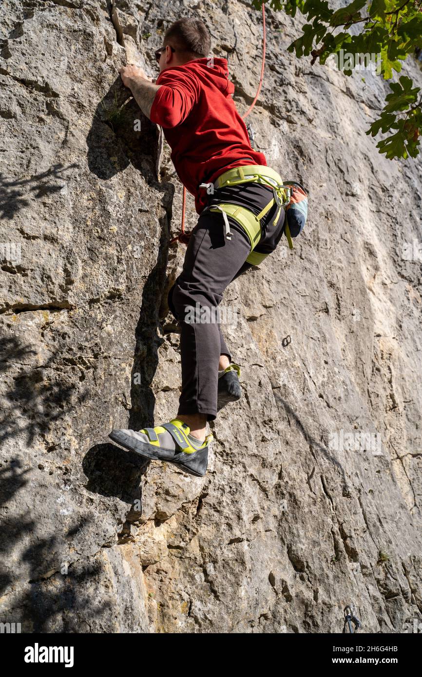 Rock climber climbing high mountains in Crni Kal Slovenia Stock Photo -  Alamy