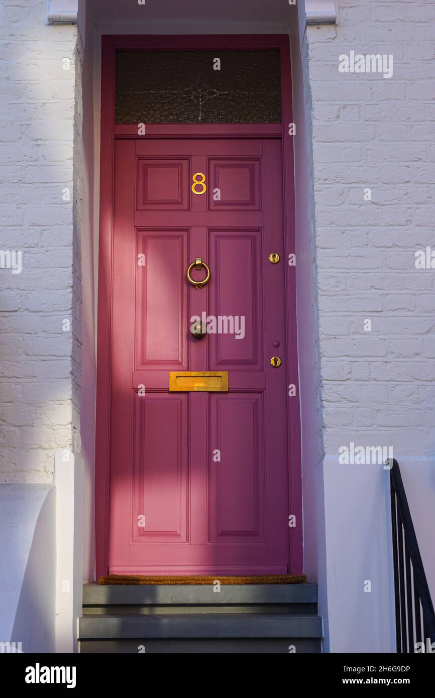 Classic pink front door of Victorian terraced house in London England United Kingdom UK Stock Photo