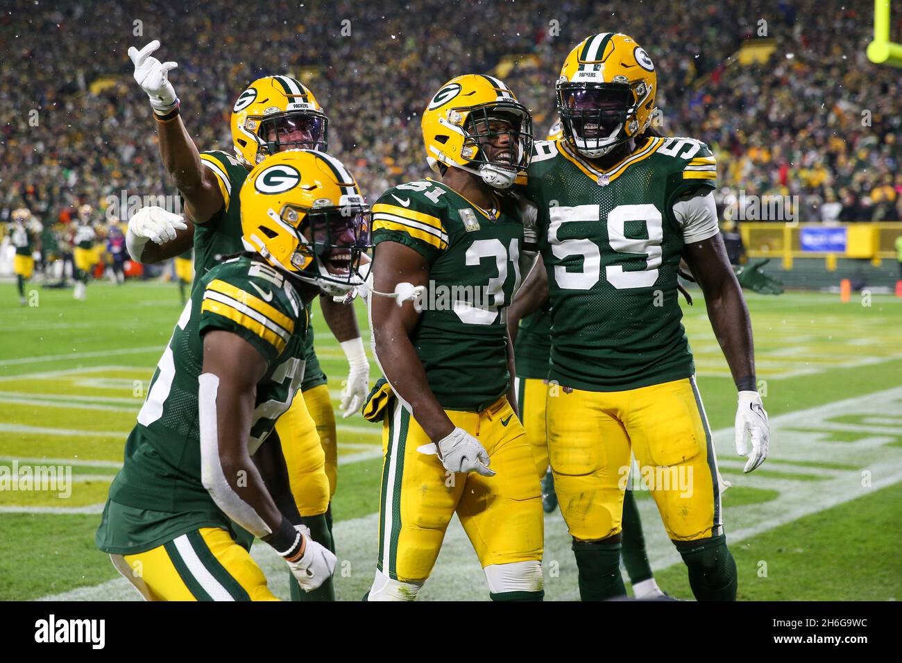 Green Bay, Wisconsin, USA. 14th Nov, 2021. Green Bay Packers safety Adrian Amos (31) celebrates his interception with inside linebacker De'Vondre Campbell (59), free safety Darnell Savage (26), and cornerback Eric Stokes (21) during the NFL football game between the Seattle Seahawks and the Green Bay Packers at Lambeau Field in Green Bay, Wisconsin. Darren Lee/CSM/Alamy Live News Stock Photo