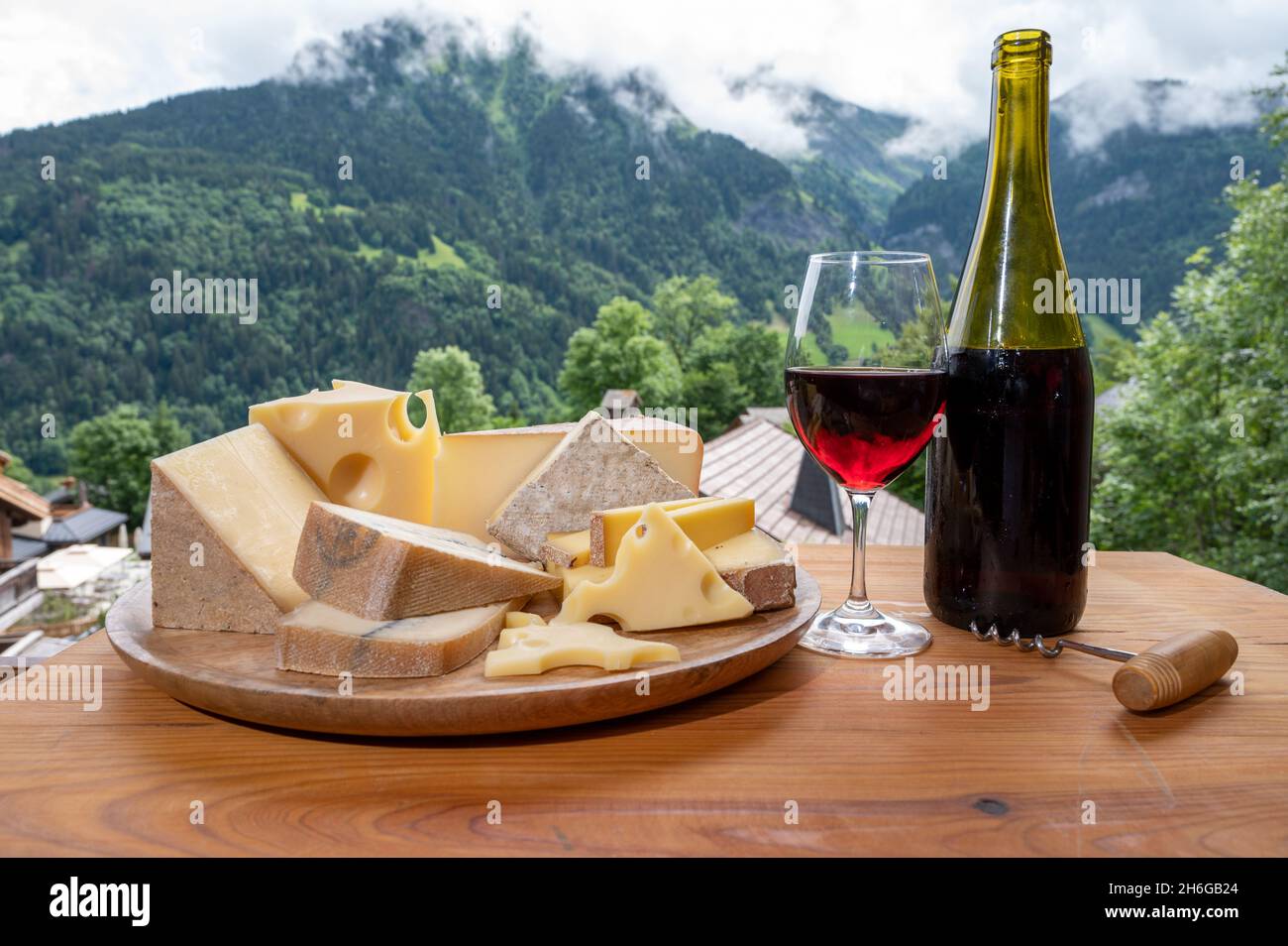 Cheese collection, wooden board with French cheeses comte, beaufort