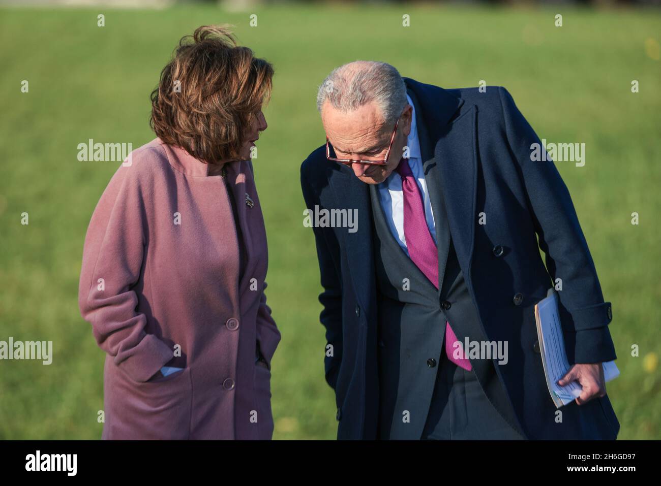 Speaker of The House Nancy Pelosi and U.S. Senate Majority Leader Chuck Schumer speak before a ceremony where President Joe Biden will sign into law his Bipartisan Infrastructure Deal, H.R. 3684, the Infrastructure Investment and Jobs Act on the South Lawn of the White House on November 15, 2021 in Washington, DC. (Photo by Oliver Contreras/Sipa USA) Stock Photo