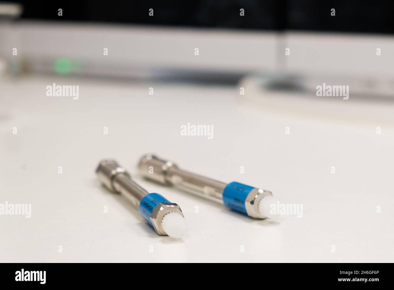 HPLC 50 mm columns on the table in the laboratory. Fast high performance liquid chromatography analysis in a chemical and microbiological laboratory. Clinical, toxicological and forensic analysis.  Stock Photo