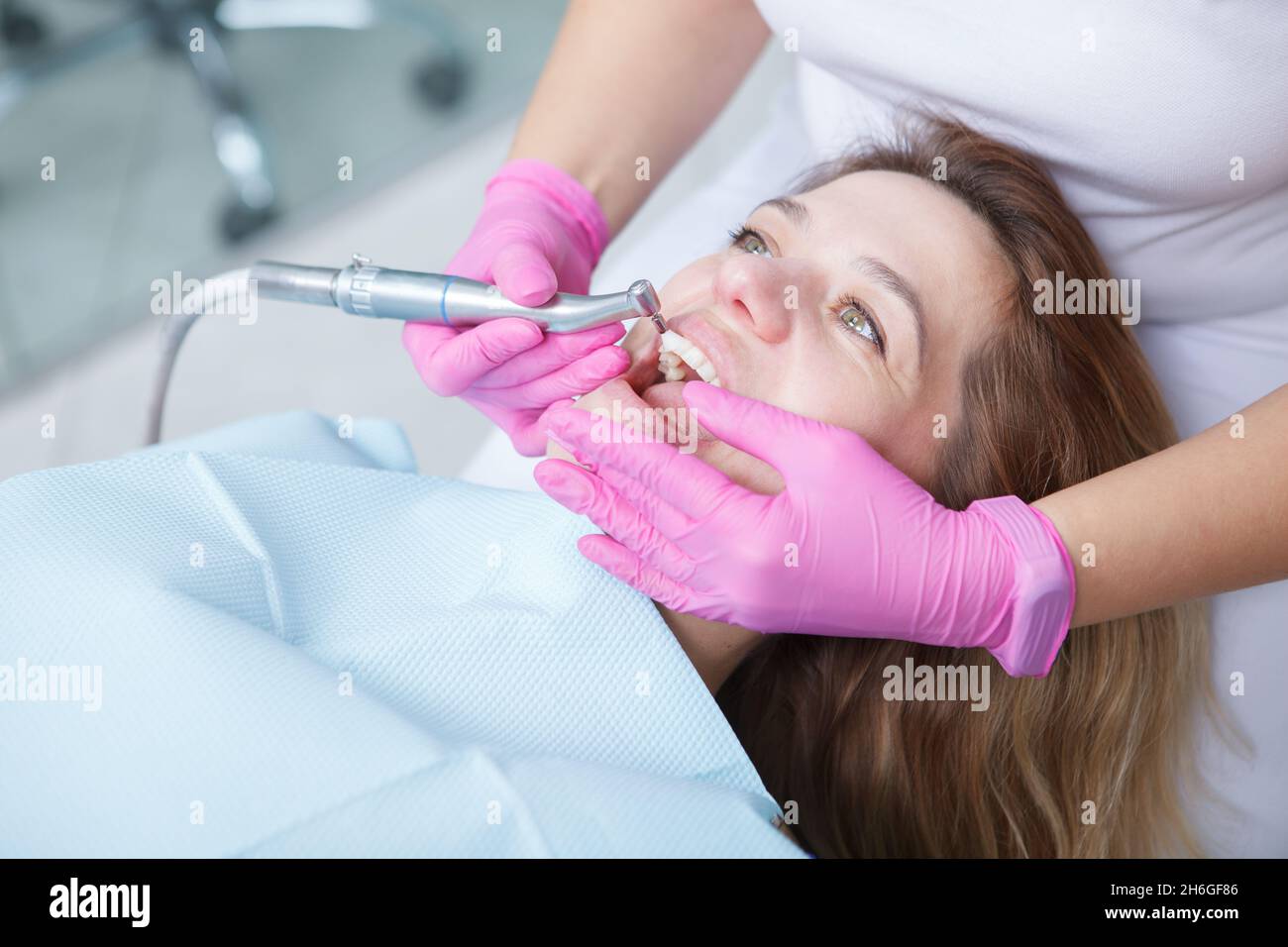 Mature woman having professional dental cleaning done by dentist Stock Photo